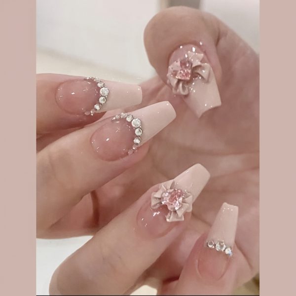 Pink French Tip with Glitter Accents and Heart & Butterfly Designs